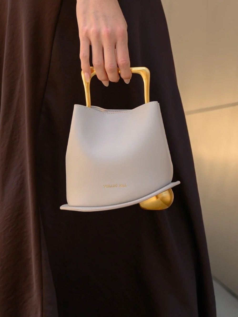 Verano Hill Taupe And Gold Handbag